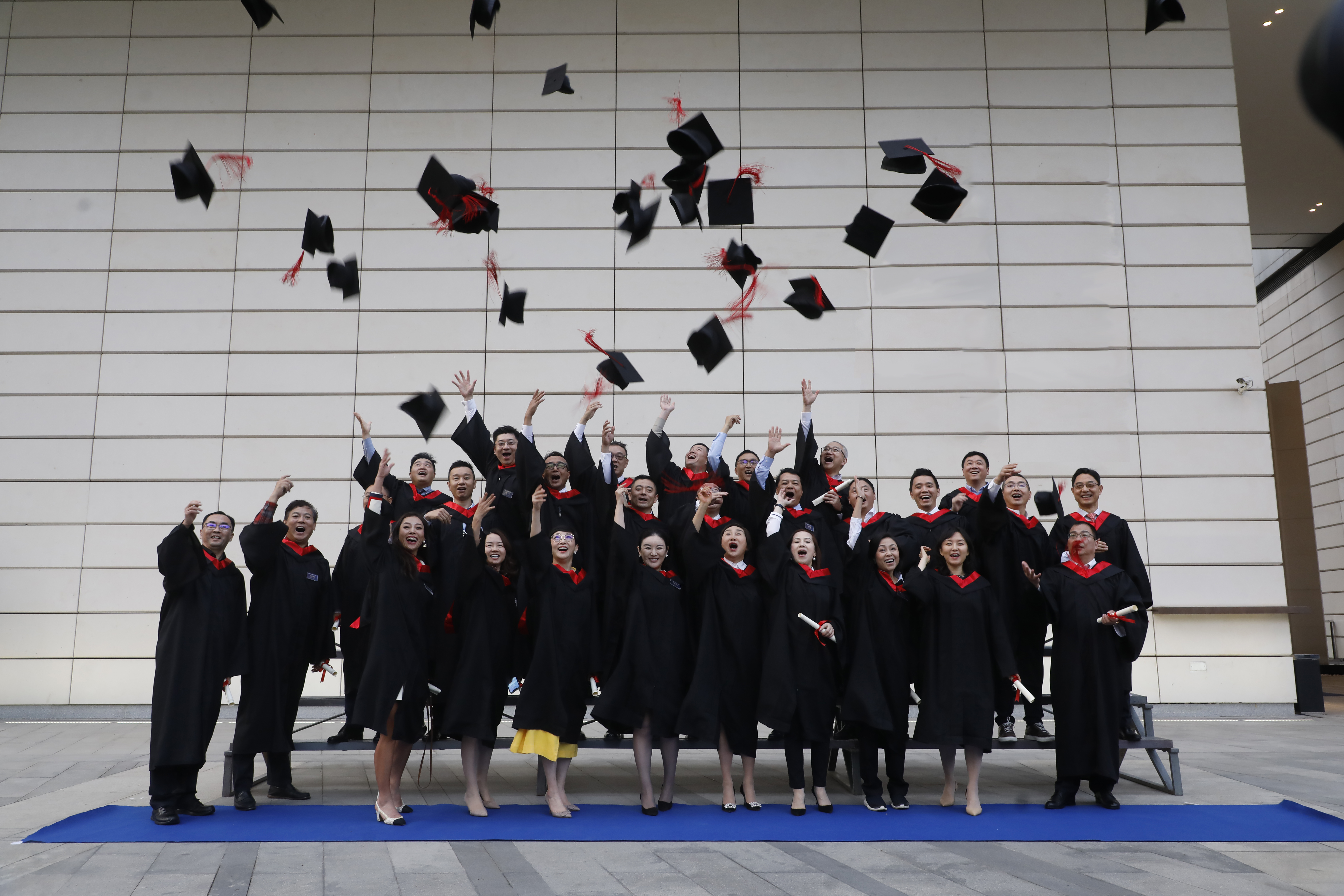 Students celebrating their graduation from China Global Philanthropy Institute, Shenzhen.