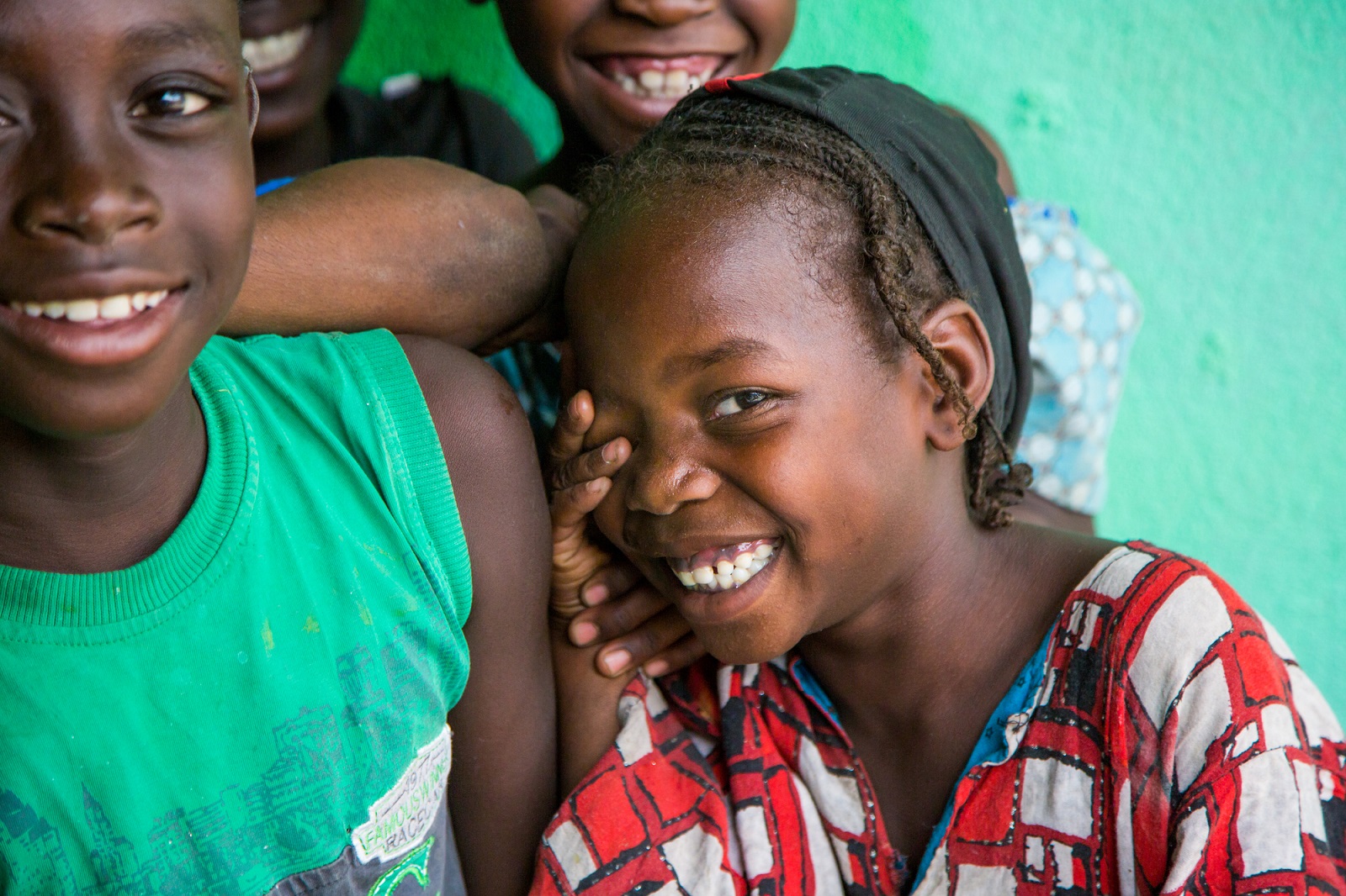 Children share a laugh during a door to door vaccine campaign in the Zaikai district in Maroua, Cameroon.