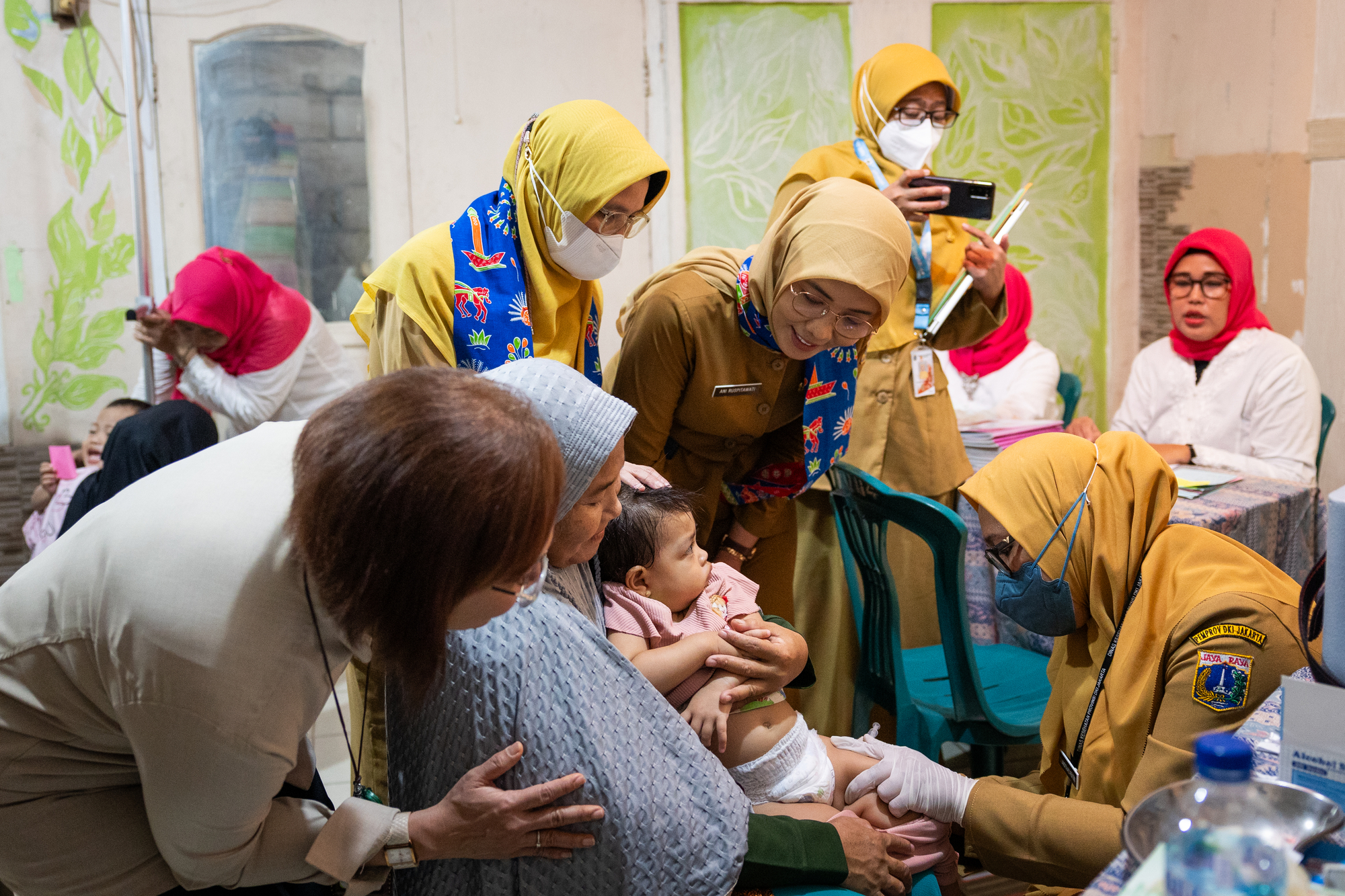 A child is vaccinated by health workers at Posyandu Cipete Utara in Jakarta, Indonesia, on September 18, 2023.  