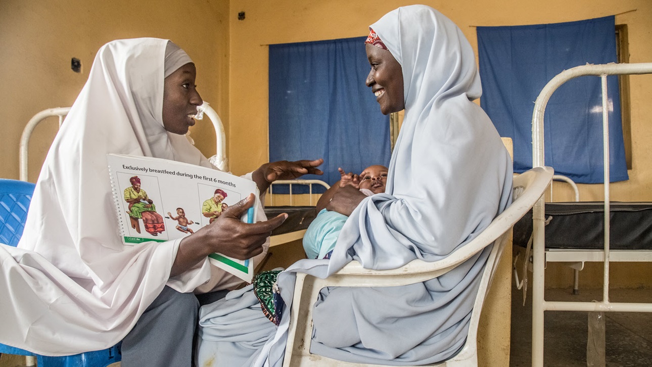 Health worker Fatima Akilu (30), sits with mother Hussaina Abubakar (26) and her son for their one-on-one breastfeeding counseling at the Rigachikun PHC at Igabi LGA, in Kaduna, Nigeria on July 17 , 2019. The counseling often takes place with both mother and health worker seated face to face for easier communication and demonstration.