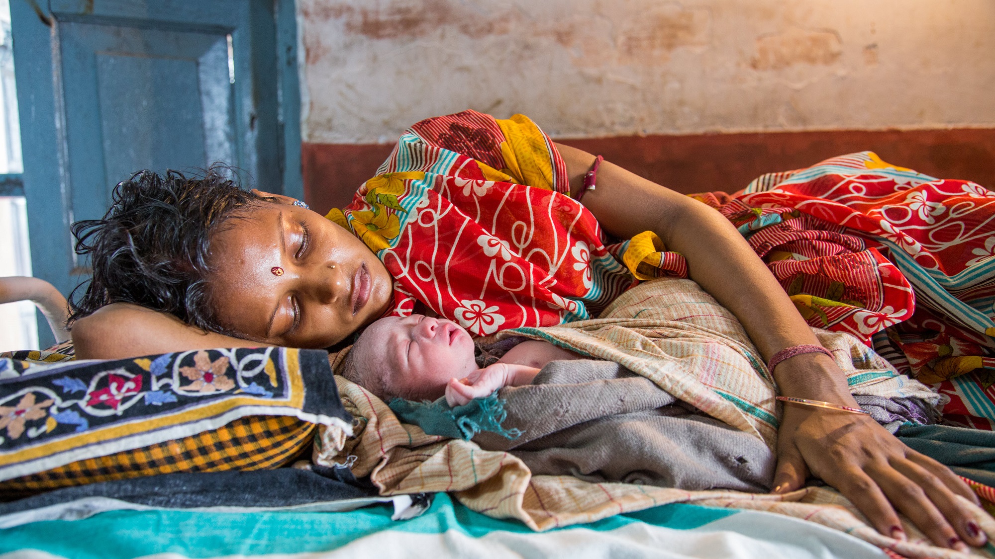 A mother and newborn at a health center in the Patna district of Bihar, India. 