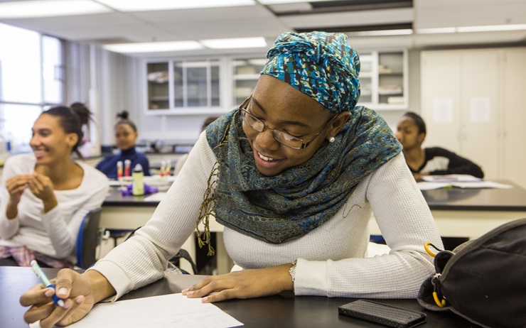 Students take notes during Biology class at Howard University, February 3, 2014. 