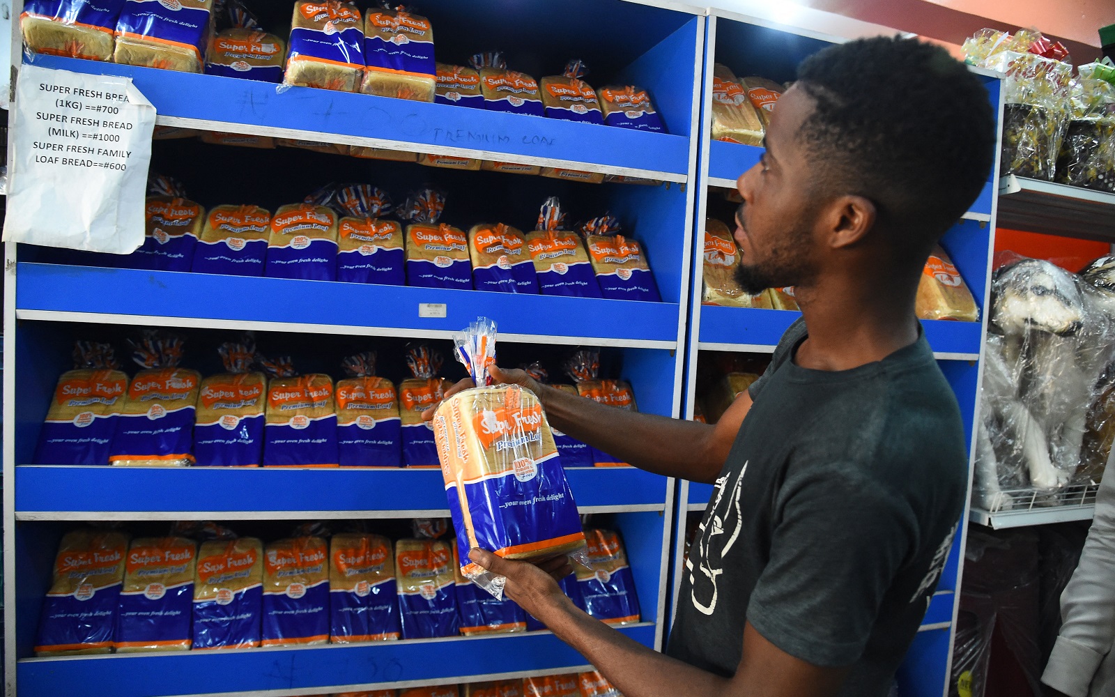 A man holds bread being sold at a high price in a supermarket in Lagos, Nigeria on March 15, 2022.