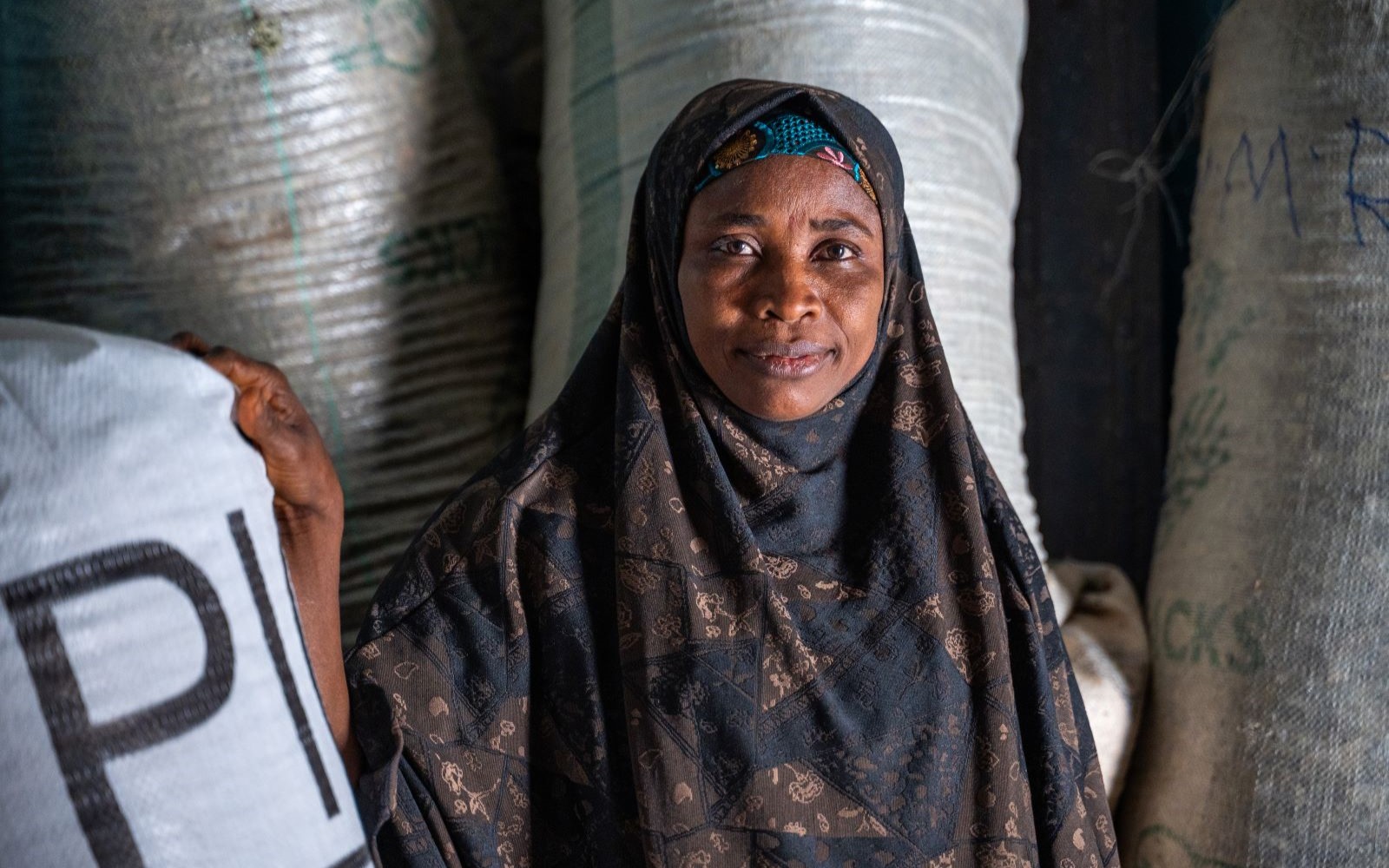 Portrait of Ramatu Alhaji Yusuf, a smallholder farmer and community leader, who empowers other women farmers to adopt climate resilient practices that cultivate improved cowpea varieties in Bichi, Kano State, Nigeria on April 2, 2025.