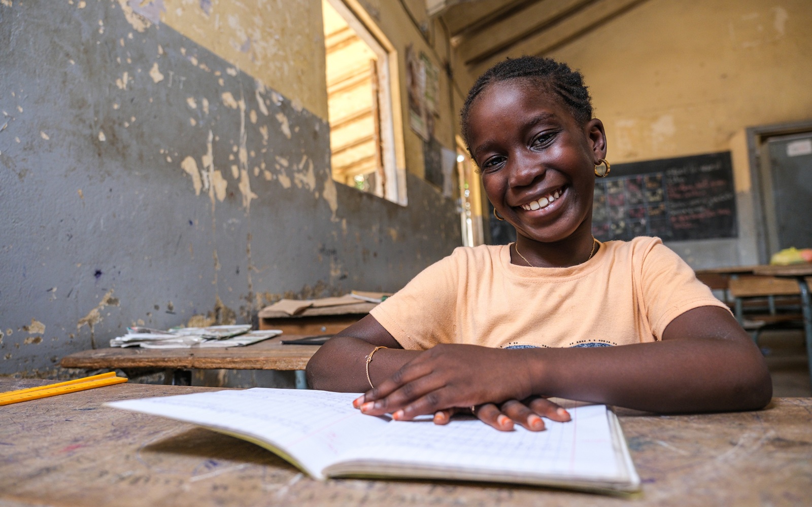 Student Fatou Ndiaye poses for a portrait in a classroom that is part of the Associates in Research and Education for Development (ARED) program in Dakar, Senegal. 