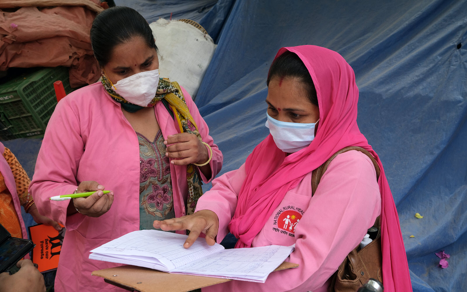 Two women looking at medical notes