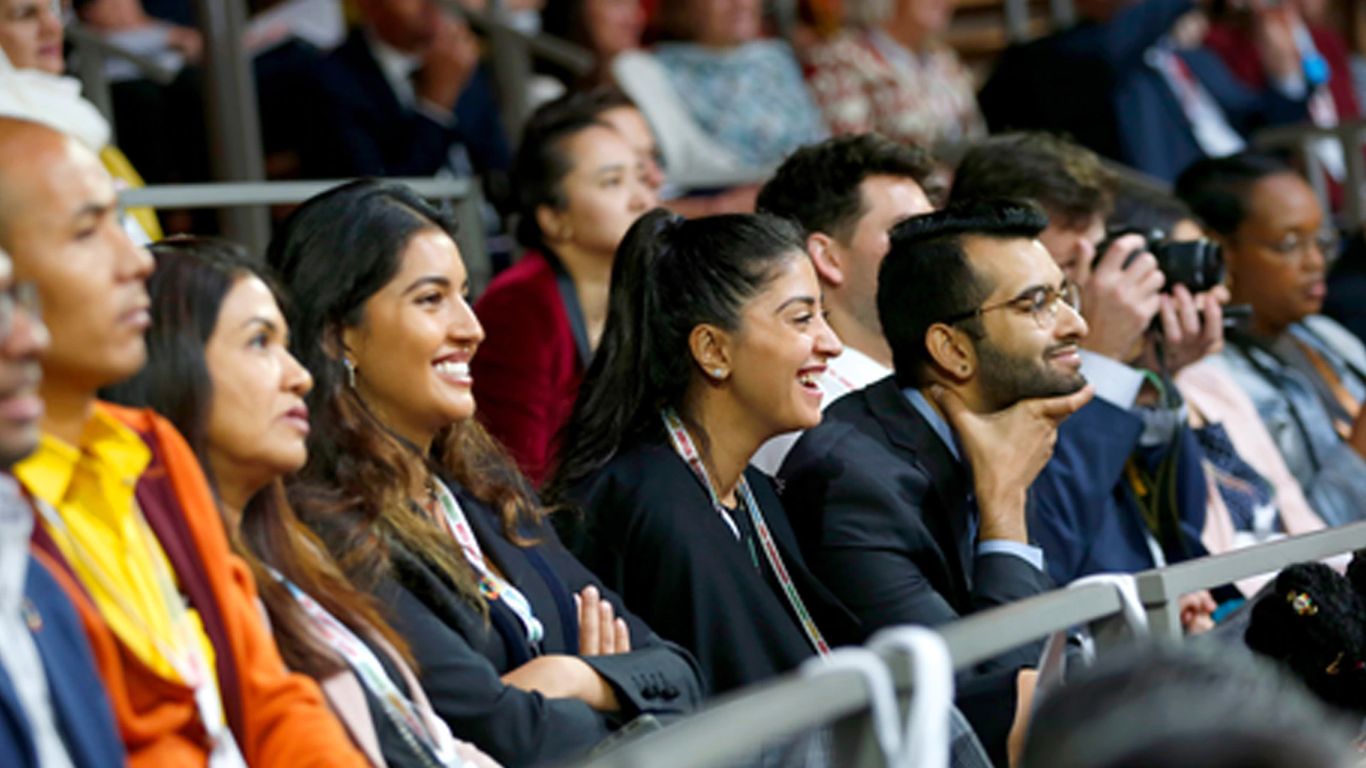 A group of people sit and listen to Goalkeepers 2018 speakers