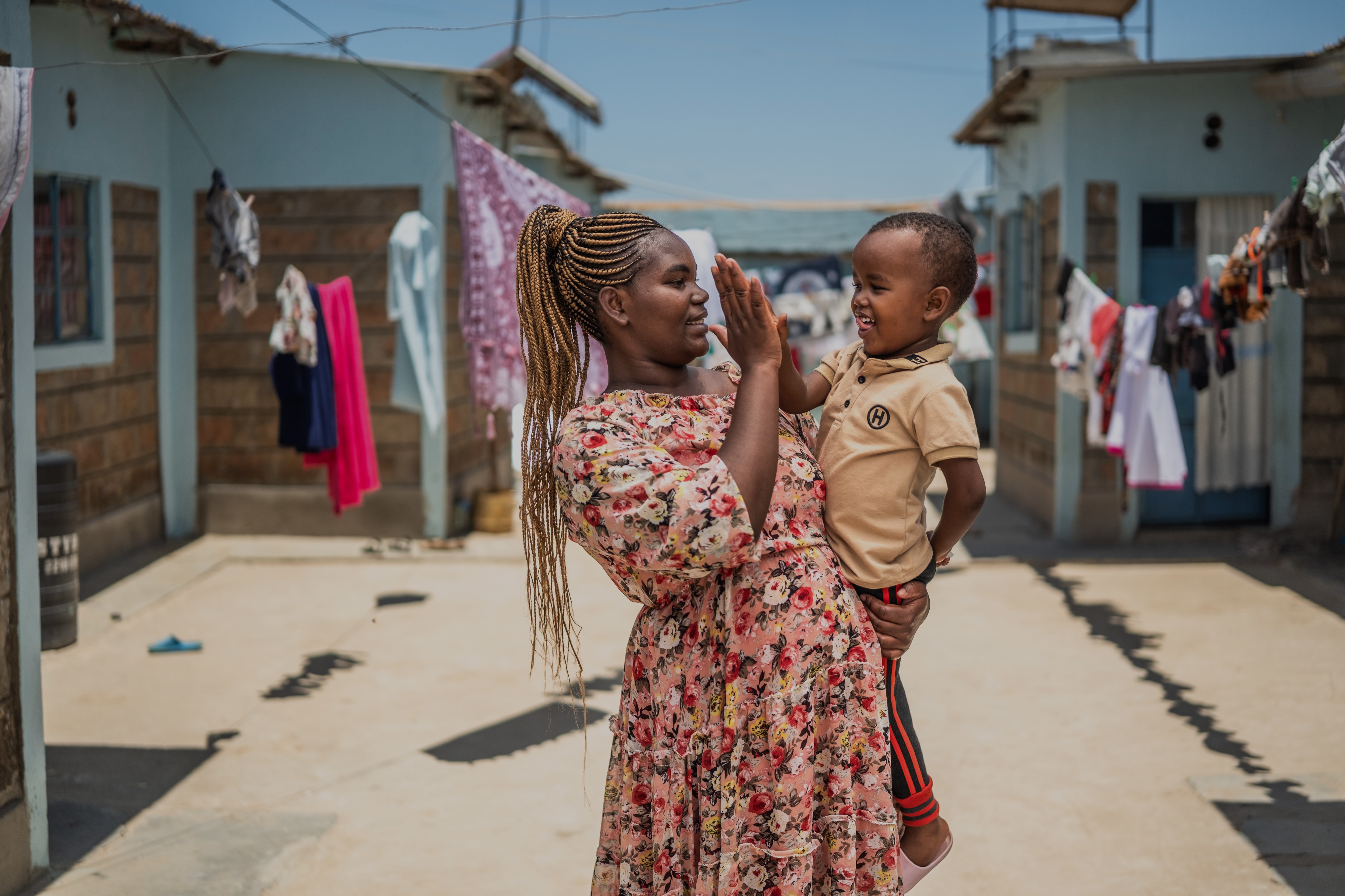 Christine and her son at their home in Wote, Makueni County, Kenya. Makueni County has implemented E-MOTIVE (Early Detection and Treatment of Postpartum Hemorrhage), which is focused on reducing maternal deaths from postpartum hemorrhage (PPH), a major cause of maternal mortality.