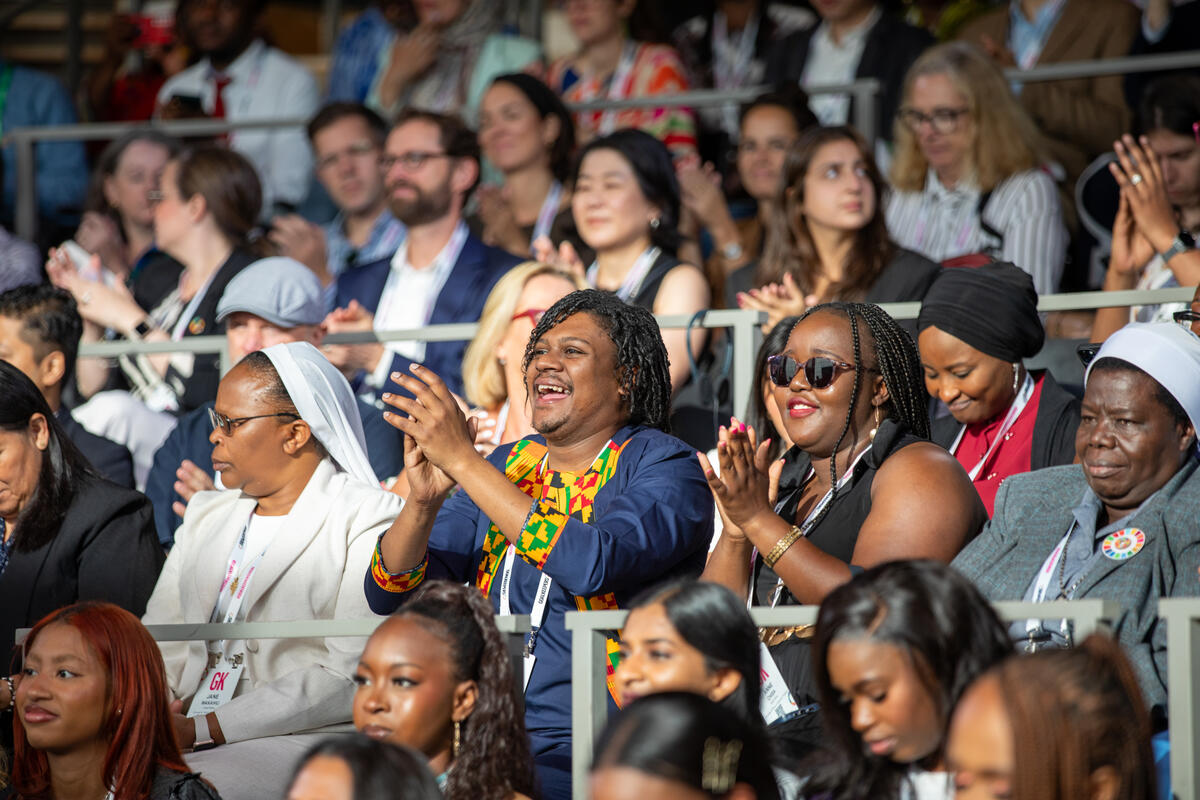 Guests watch the Hot 8 Brass Band perform during Goalkeepers 2023. ©Gates Archive/Kevin Hagen