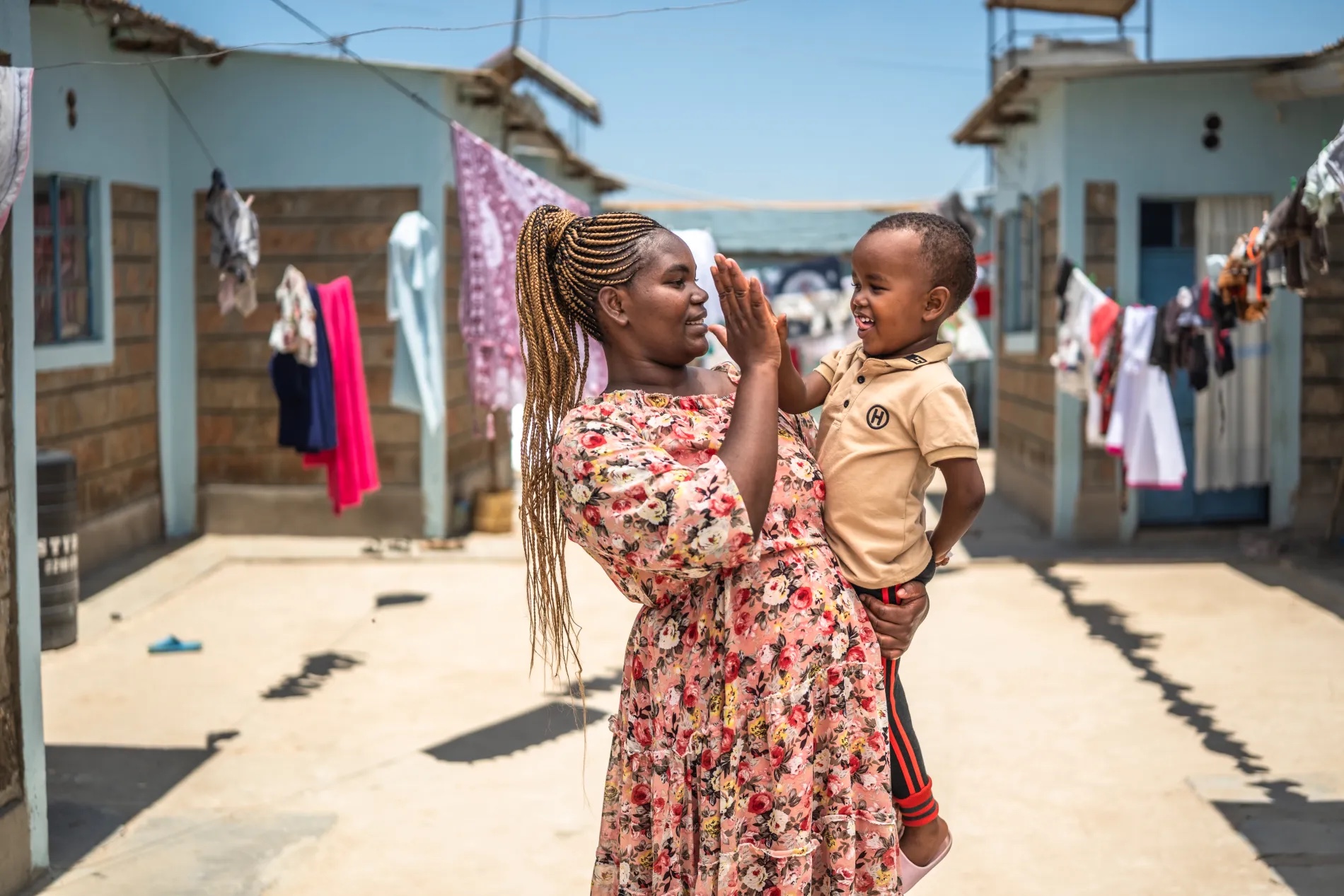Christine and her son at their home in Wote, Makueni County, Kenya. Makueni County has implemented E-MOTIVE (Early Detection and Treatment of Postpartum Hemorrhage), which is focused on reducing maternal deaths from postpartum hemorrhage (PPH), a major cause of maternal mortality.