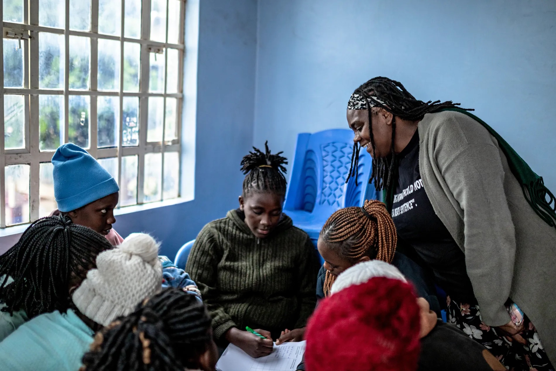 Josephine Barasa, a community health worker, mentor to young women, and advocate against gender-based violence (GBV), leads a SRHR workshop for young girls in Kangemi, Nairobi county.