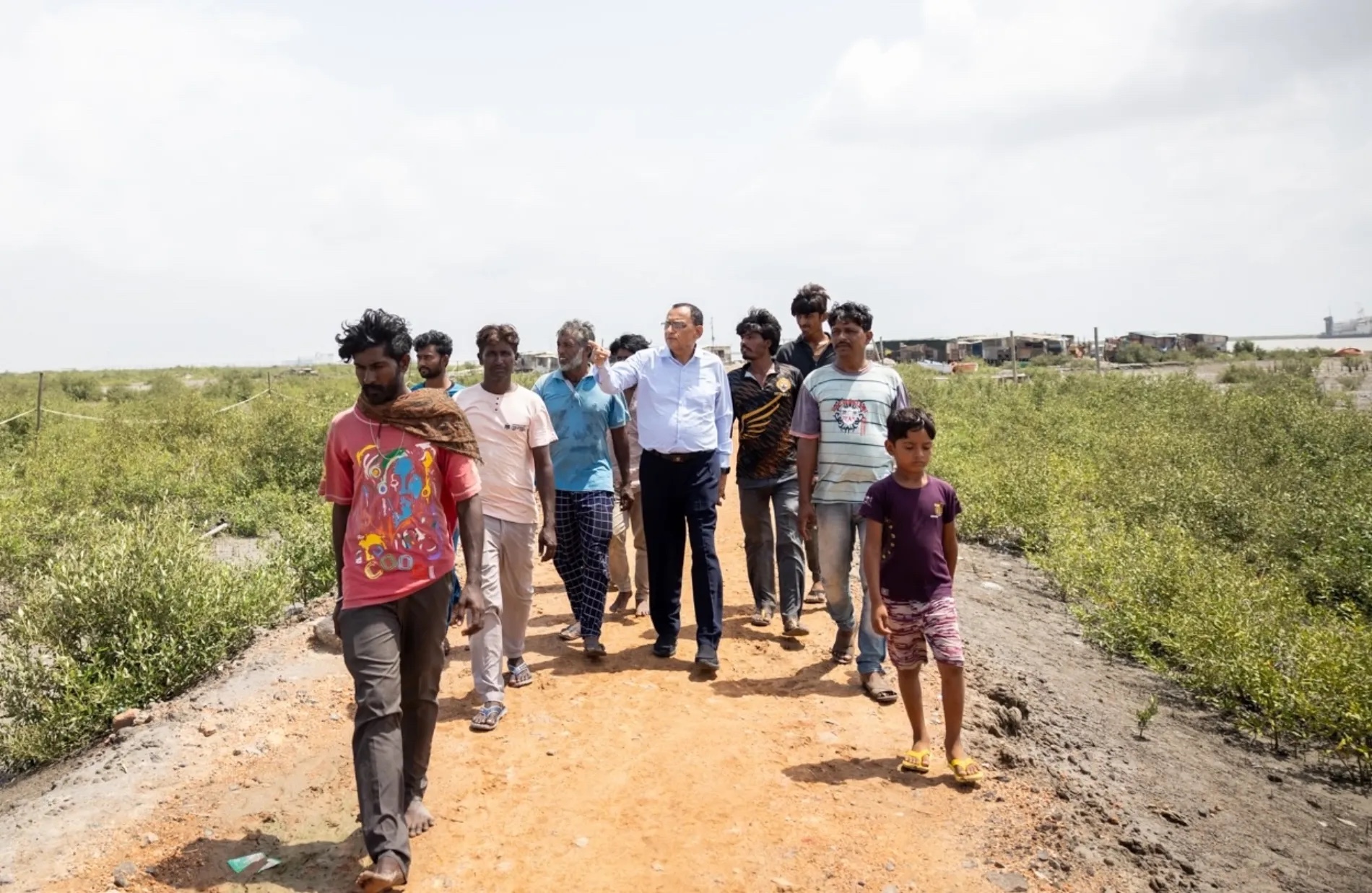 Dr. Naveen Thacker, Pediatrician, lifelong advocate against polio, and President of the International Paediatric Association, walks through a settlement in Gandhidham, Gujarat, India.